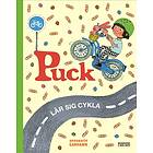 Puck lär sig cykla